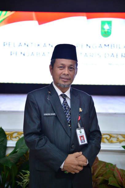 Drs. H. Masrul Kasmy, M.Si