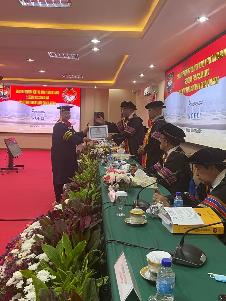 Dr. Nofli, Bc.IP, S.Sos., SH, M.Si. 1